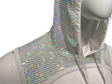 Load image into Gallery viewer, Close up view of a white hooded harness with holographic flat sequins covering the fabric, displayed on a mannequin.
