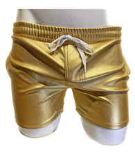 Load image into Gallery viewer, Mannequin wearing gold faux leather shorts with side pockets and a white string waistband