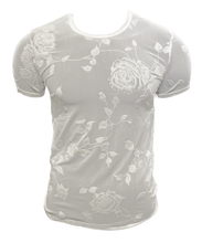 Load image into Gallery viewer, A white mesh fabric t-shirt with a flocked rose and leaves pattern, displayed on a mannequin.