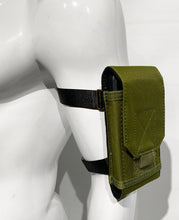 Load image into Gallery viewer, Army green canvas arm/leg bag worn on the arm of the mannequin, with a phone in the pocket and the flap down.