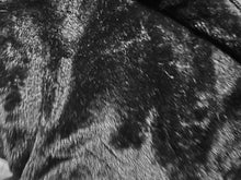 Load image into Gallery viewer, Close up view of black faux fur fabric