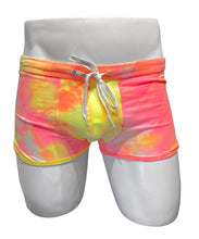 Load image into Gallery viewer, Mannequin wearing tie-dyed pink and yellow stretch booty shorts with drawstring waistband
