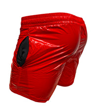 Load image into Gallery viewer, Rear view of bright red high gloss shorts, showcasing the side pockets.