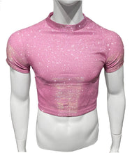 Load image into Gallery viewer, A light pink glitter crop tee on a mannequin. The shirt features short sleeves and a crew neckline, and is covered in small glitter particles that sparkle in the light.