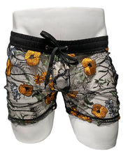 Load image into Gallery viewer, A pair of black and orange floral mesh shorts with side pockets and a drawstring waistband displayed on a mannequin.