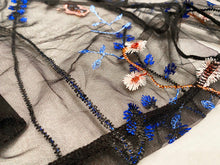 Load image into Gallery viewer, Close up view of the black blue embroidered floral mesh fabric to show detail