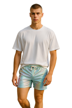 Load image into Gallery viewer, Man wearing a white t-shirt and metallic mint-colored shorts with white drawstring waistband.