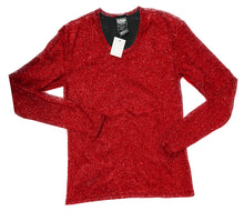 Load image into Gallery viewer, A long sleeve red glitter t-shirt with a round neckline and tag visible