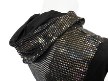 Load image into Gallery viewer, Side view of mannequin wearing a black hooded crop tank top covered in silver reflective sequins.