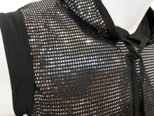 Load image into Gallery viewer, Close up view of neckline of a black hooded crop tank top covered in silver reflective sequins.