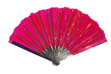 Load image into Gallery viewer, Iridescent fuchsia-colored fan with black painted bamboo spines and a rose gold back with emerald undertones.