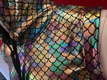 Load image into Gallery viewer, Close up of neckline of mannequin wearing a metallic mermaid scale pattern hooded crop top with many colors, including teal, slate blue, gold, purple, and bronze.