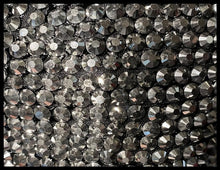 Load image into Gallery viewer, Close-up of rhinestones on a black background
