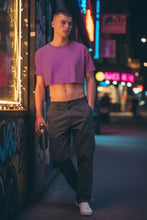 Load image into Gallery viewer, Acid wash cotton crop tee in purple, on a model in a night time street setting
