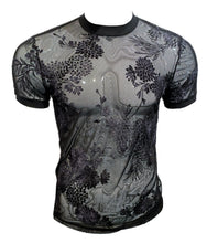 Load image into Gallery viewer, A short-sleeve crewneck t-shirt featuring a sheer gray mesh fabric with a black floral textured aspects. Displayed on a mannequin torso against a white background.
