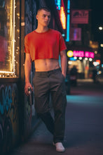 Load image into Gallery viewer, Acid wash cotton crop tee in crimson red, on a model in a night time street setting
