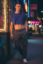 Load image into Gallery viewer, Acid wash cotton crop tee in slate blue, on a model in a night time street setting
