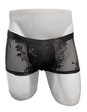 Load image into Gallery viewer, Black sheer mesh boxer briefs with a floral overlay, displayed on a white mannequin torso against a plain white background.
