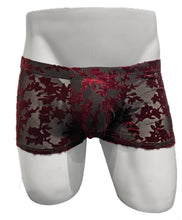 Load image into Gallery viewer, Red and black lace-patterned boxer briefs displayed on a white mannequin torso against a white background.
