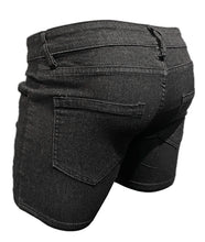 Load image into Gallery viewer, Black denim shorts shown from the back, featuring a classic five-pocket design and belt loops, photographed against a solid white background.
