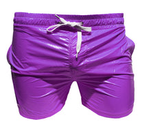 Load image into Gallery viewer, A pair of lavender high gloss shorts with two side pockets and a drawstring waist.
