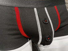 Load image into Gallery viewer, Close up view of underwear, showing red trim around the pouch and the button fly.
