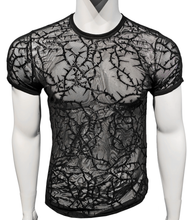 Load image into Gallery viewer, Black mesh t-shirt with a thorny vine design on a white mannequin
