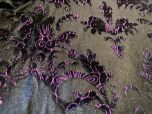 Load image into Gallery viewer, Close up detail photo of flocked floral embellishments, that are black with purple accents
