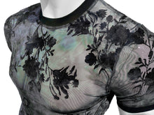 Load image into Gallery viewer, A close-up of a sheer black and blue  floral mesh t-shirt with a black crew neck and short sleeves, displayed on a white mannequin torso against a white background.
