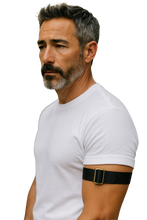 Load image into Gallery viewer, Man wearing a white t-shirt with a black arm band, brass buckle showing
