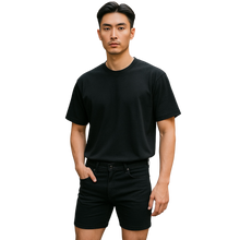Load image into Gallery viewer, Man wearing a black t-shirt and black jean shorts 
