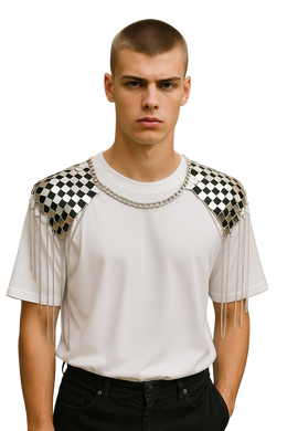 Man wearing a white t-shirt with a silver chain necklace attached to checkered shoulder decoration with fringe details