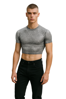 Man wearing a silver glitter crop top and black pants 