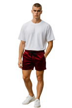 Load image into Gallery viewer, Man wearing a white t-shirt and dark red shorts with pockets and drawstring
