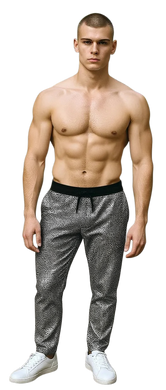 Man wearing black pants with silver sequins and black drawstring and white sneakers on a white background