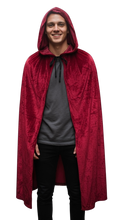 Load image into Gallery viewer, Person wearing a knee length red hooded cloak with a plain background

