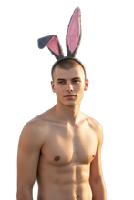Load image into Gallery viewer, Man wearing a grey headband with grey/pink faux fur bunny ears attached
