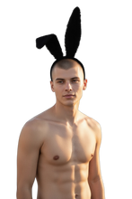 Load image into Gallery viewer, Man wearing a black headband with black faux fur bunny ears attached
