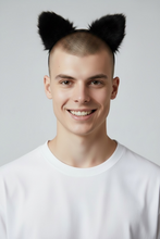 Load image into Gallery viewer, Model wearing a black headband with attached black fuzzy faux fur cat ears
