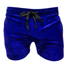 Load image into Gallery viewer, Front view of royal blue velvet shorts with pockets and a drawstring waistband
