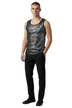 Load image into Gallery viewer, Model wearing a silver and black metallic tank top with a tiger stripe pattern. The fabric is speckled with sequins.
