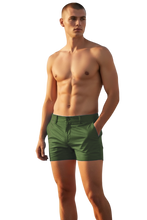 Load image into Gallery viewer, Army green chino shorts worn by a shirtless model
