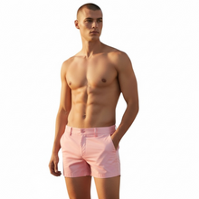 Load image into Gallery viewer, Light pink chino shorts worn by a shirtless model
