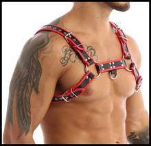 Load image into Gallery viewer, Red and black faux leather harness worn by a person with tattoos on a white background

