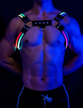 Load image into Gallery viewer, Model wearing multi color glow harness in low light
