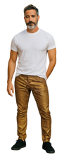Load image into Gallery viewer, Man wearing a white t-shirt and gold glitter pants
