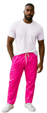 Load image into Gallery viewer, Man wearing a white t-shirt and bright pink pants
