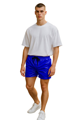 Man wearing a white t-shirt and royal blue shorts on a white background