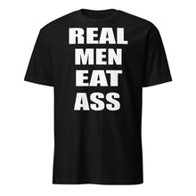 Load image into Gallery viewer, Black t-shirt with white text &#39;REAL MEN EAT ASS&#39;
