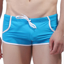 Load image into Gallery viewer, Pocket Swim Trunks - Blue with white trim
